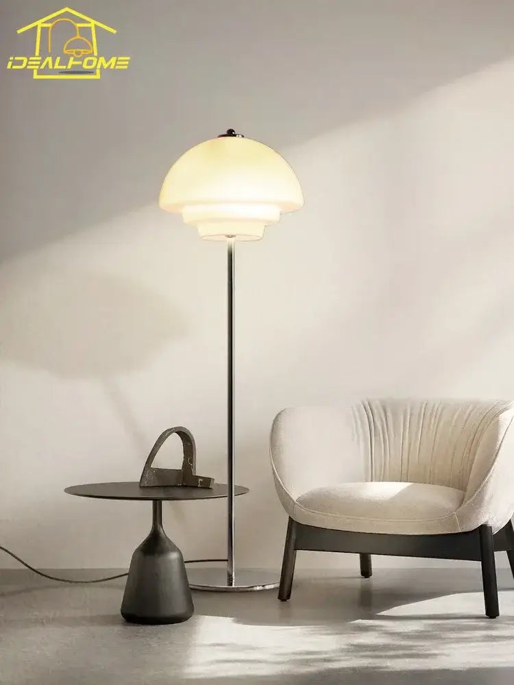 Modern bauhaus cream glass floor lamp with warm translucent off-white dome shade and slender metallic pole for living room decorbites cream glass