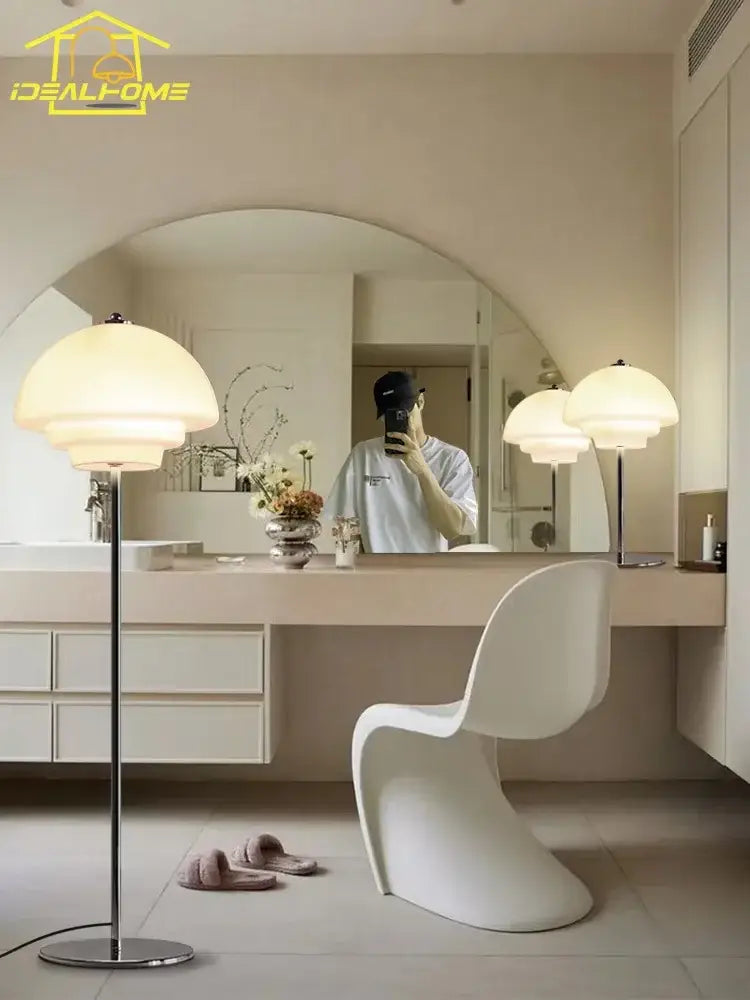 White molded plastic chair paired with modern bauhaus cream glass floor lamp for stylish living room decorbites cream glass design