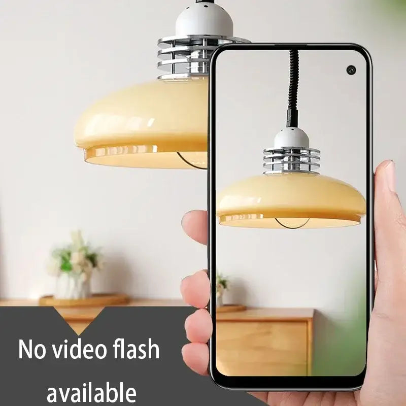 A sleek black smartphone displaying a modern bauhaus cream glass led chandelier with chrome accents