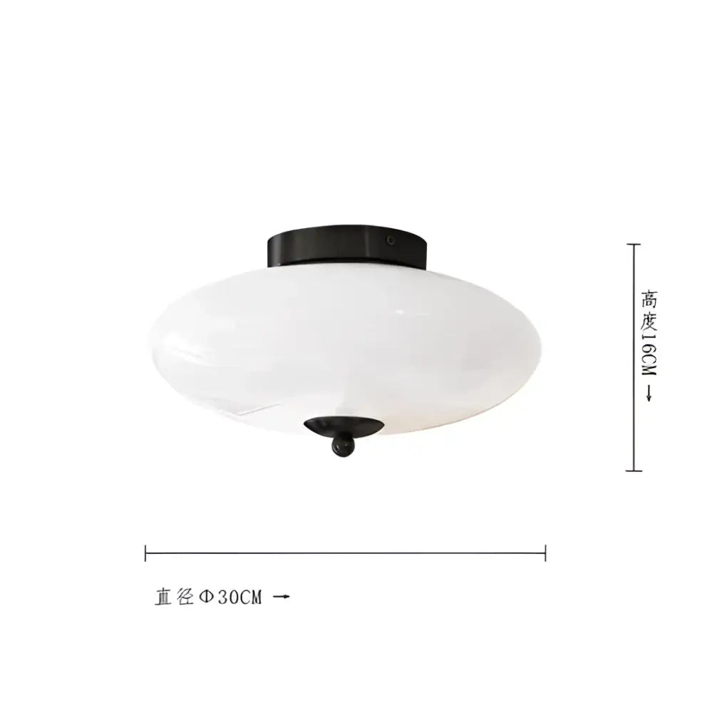 Modern bauhaus cream white glass ceiling lamp with frosted oval shade and black metal mounting for bedroom lighting