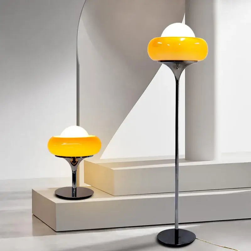 Modern bauhaus table lamp with yellow and white glass shade and sleek chrome base for decorbites guzzini modern lighting