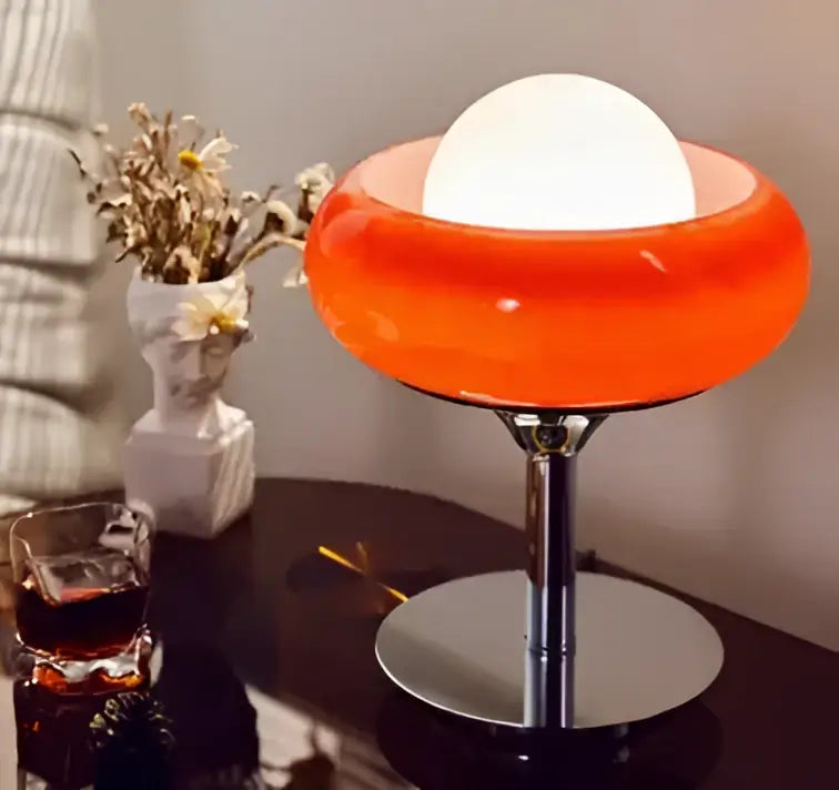 Modern bauhaus table lamp with vibrant orange glass dome shade and sleek chrome base from guzzini modern collection
