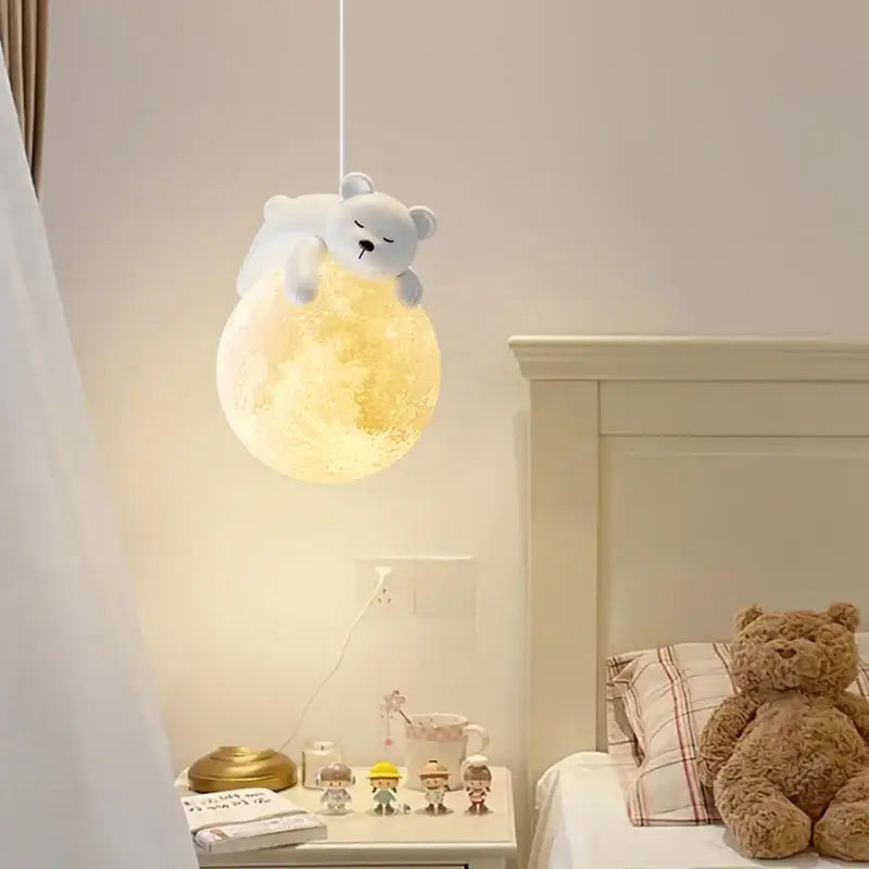 Modern bear led pendant light featuring a soft yellow moon shape with a plush white bear on top for bedroom use