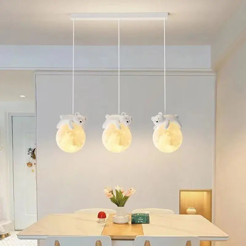 Three plush white bear led pendant lights with glowing yellow moon lampshades for modern bedroom lighting