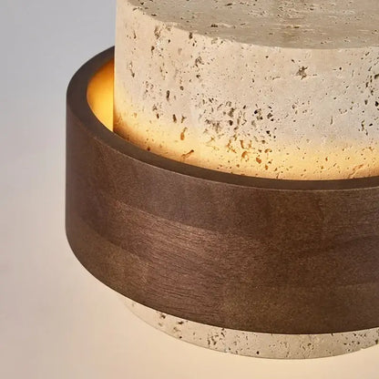 Modern table lamp with textured beige stone upper and warm light from dark walnut wood finish base for dining room