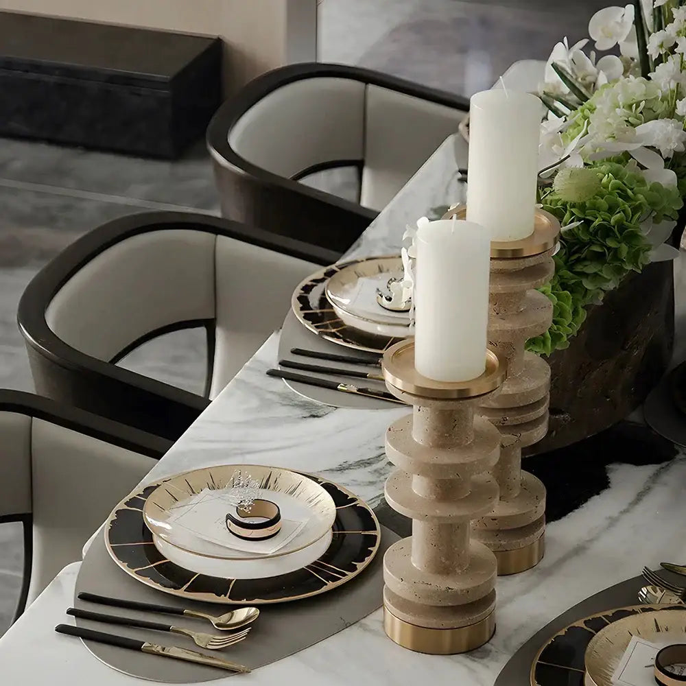 Modern beige and brown travertine candle holder with metal base featuring gold-toned rings for dining room decorbites beige brown