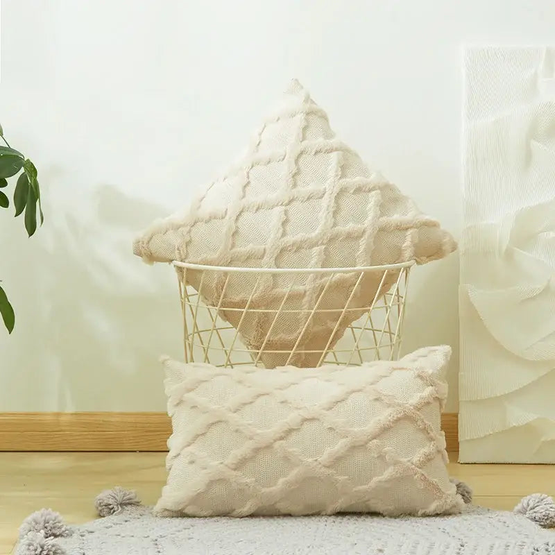 Cream-colored cushion cover with diamond solid embroidery and textured fringe edges for modern living room decor