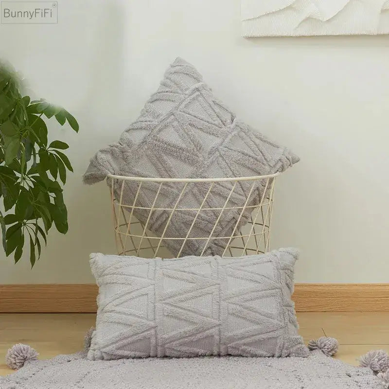 Gray textured throw pillows with geometric knit pattern and tassels featuring diamond solid embroidery cushion cover