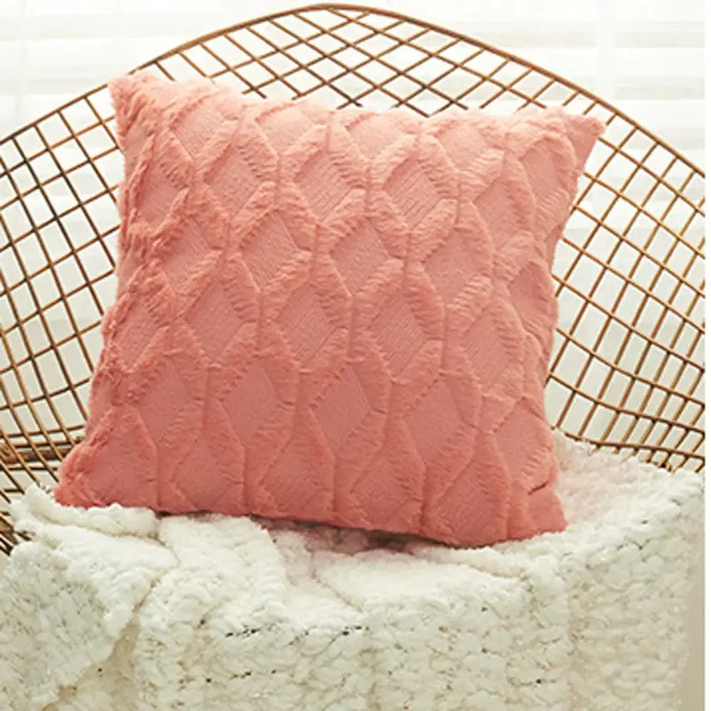 A blush pink soft throw pillow with diamond solid embroidery cushion cover in plush fabric for living room decor