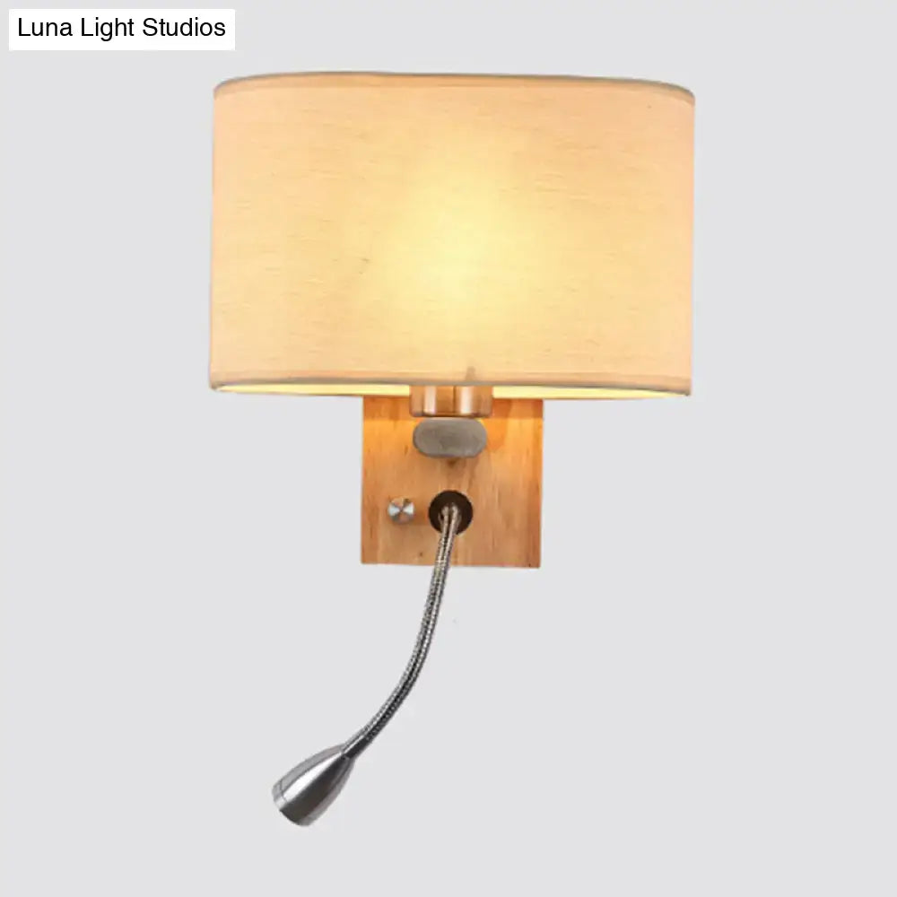 Modern beige fabric bedside reading lamp with warm-toned cylindrical shade and adjustable metallic gooseneck 5 inch fixture