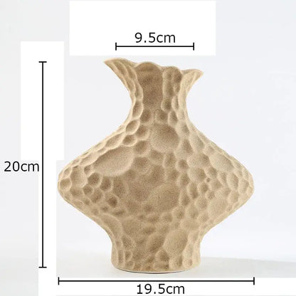 Modern beige frosted ceramic vase with a textured hammered surface and flared neck for living room decorbites frosted decor