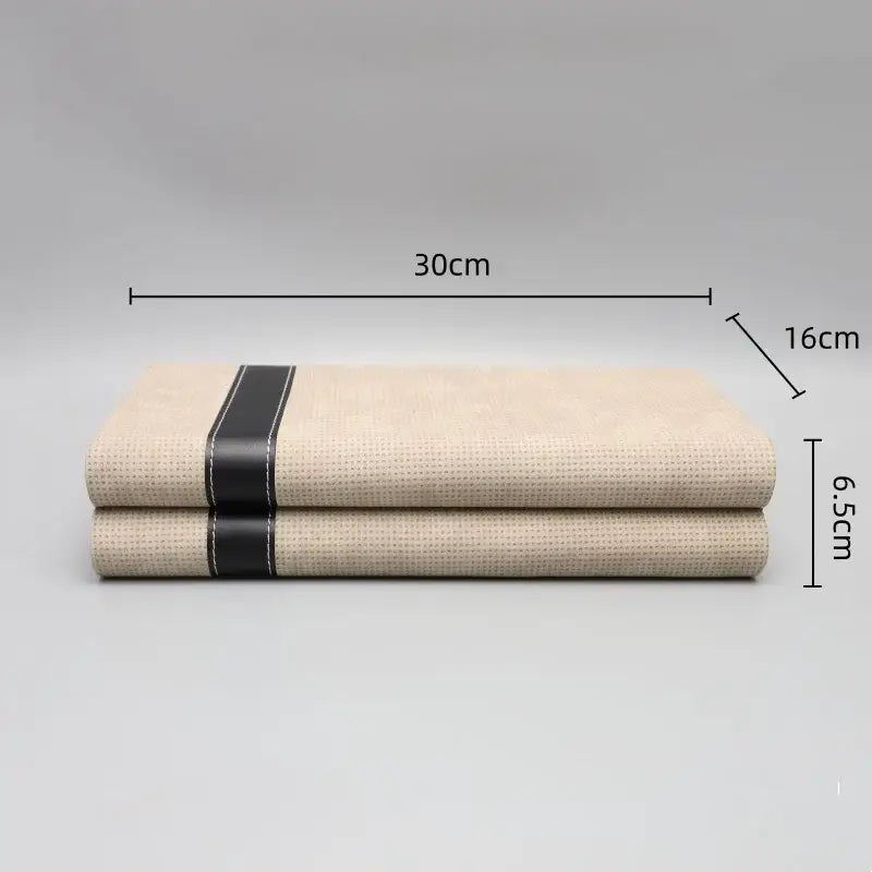 Modern beige geometric jewelry storage box with a beige woven fabric cover and black leather strap for decorbites jewelry storage