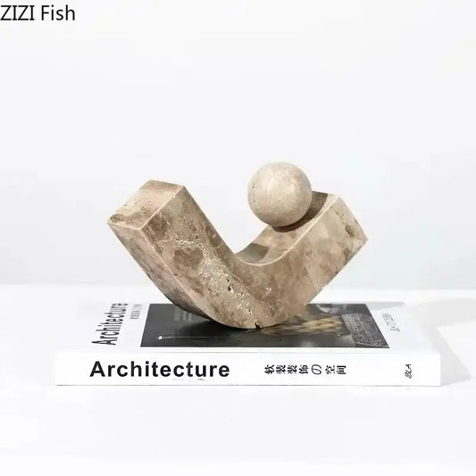 Modern beige geometric stone sculpture with curved angular base and smooth sphere top for desk decoration decorbites geometric stone