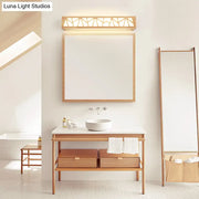 Modern beige geometric wooden wall lamp with intricate lattice design and warm glow suitable for bathroom use