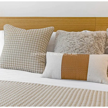 Beige gold houndstooth jacquard lumbar pillow with textured woven leather stripe for modern bedroom decorbites beige gold decor