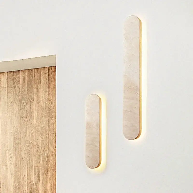 Two sleek modern beige marble courtyard led wall sconces with warm backlighting for outdoor decorbites courtyard led use