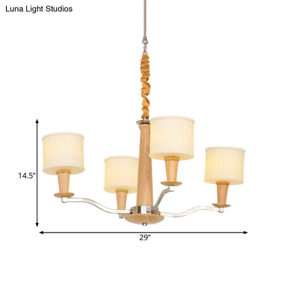 Lámpara de araña radial moderna color beige con pantalla cilíndrica de cristal color crema y 4 cabezales de madera.