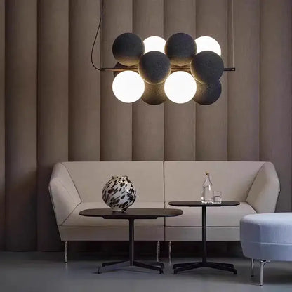 Modern beige and white decorbites abstracta pendant lamp with matte black and white orbs for dining room lighting