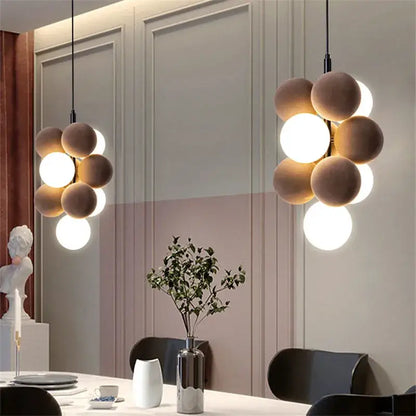 Modern beige and white abstracta pendant lamp with matte and glowing spherical bulbs for dining room decorbites chandelier