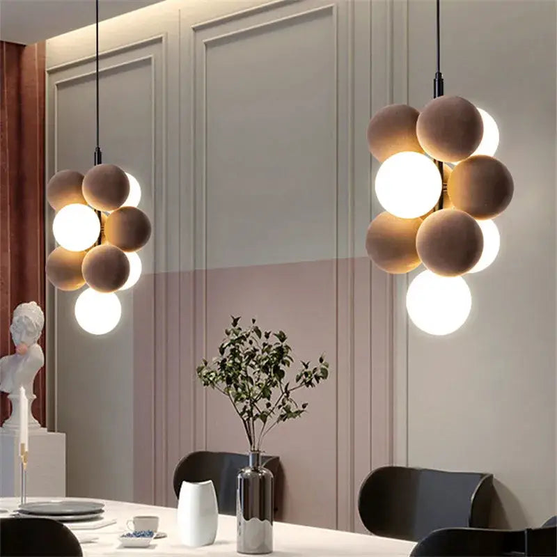Modern beige and white abstracta pendant lamp with matte and glowing spherical bulbs for dining room decorbites chandelier