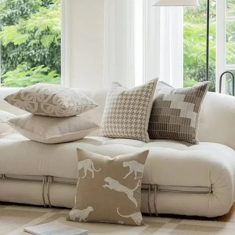 Beige jacquard cushion cover with embroidered white leopard silhouettes for modern living room decorbites cushion covers