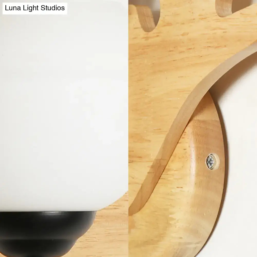 Modern beige wood deer head wall light with frosted white glass shade black base and curved wood bracket fixture