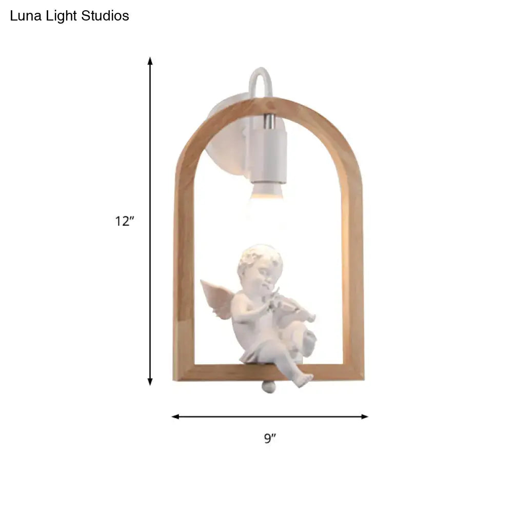 Modern beige wooden arched wall lamp with white ceramic cherub decor and power source, measuring nine inches tall