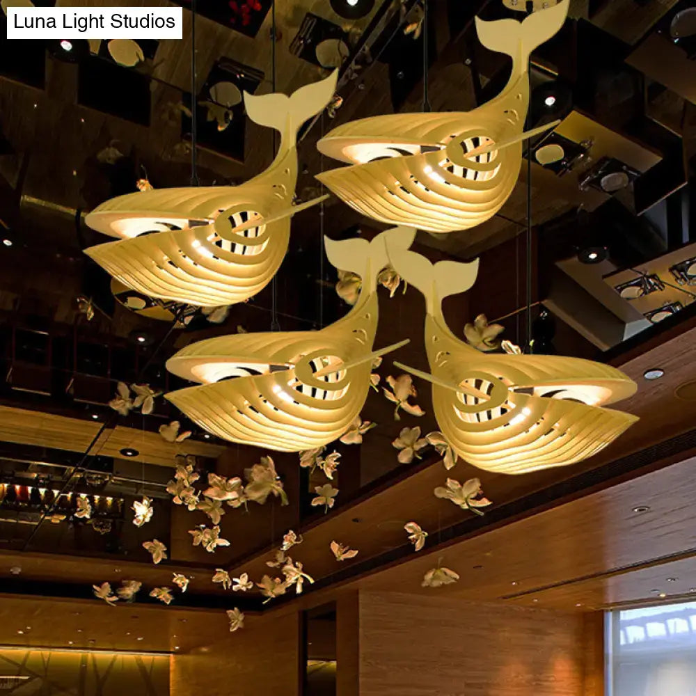 Modern beige wooden whale kids pendant light featuring golden layered cut-out whale-shaped modern hanging lamps