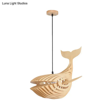 A modern hanging light beige wooden whale kids pendant lamp with sleek layered design and natural wood finish