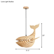 A modern hanging light beige wooden whale kids pendant lamp with a sleek layered design and black cord suspension