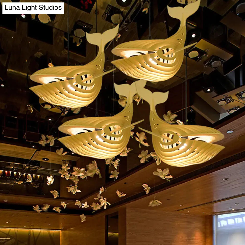 Modern beige wooden whale kids pendant light with layered design and warm internal illumination for bedroom use