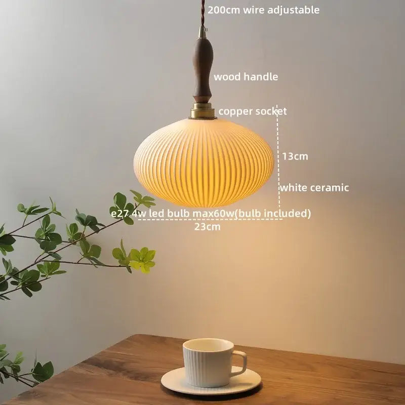 A warm softly glowing white ceramic led pendant light with vertical ridges and wooden handle for modern decorbites decor