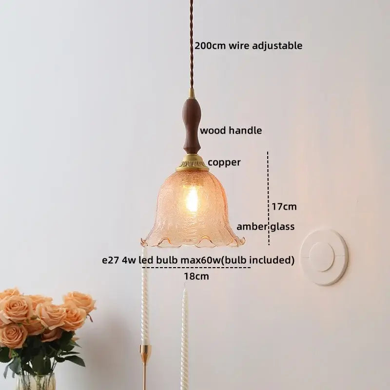 A warm amber glass ceramic led pendant light with wooden handle and copper accents for modern bedroom decorbites decor