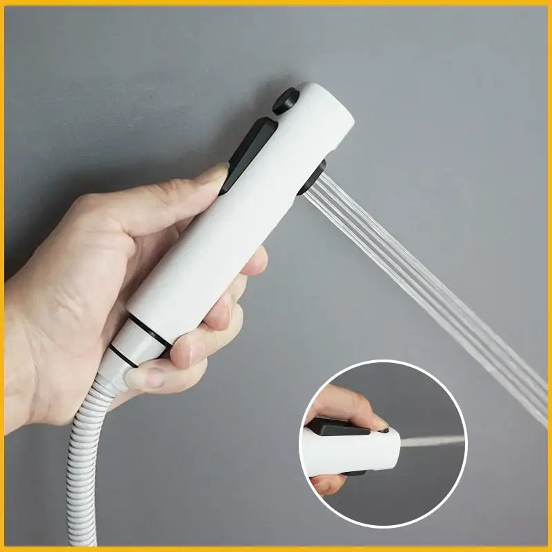 Modern bidet faucet set with white handheld showerhead featuring black accents and flexible coiled hose for versatile use
