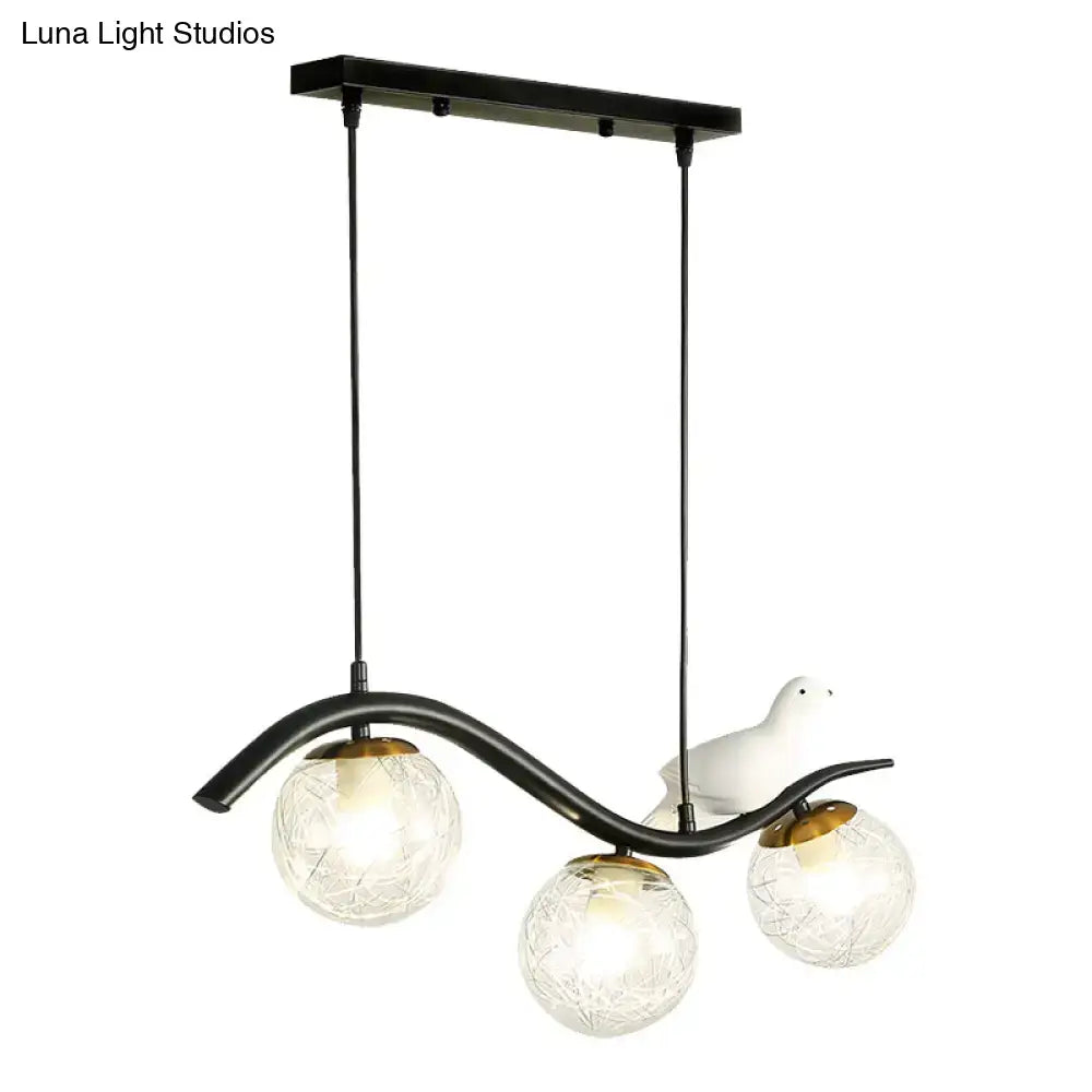 DecorBites modern black metal pendant lamp with three clear white textured ball shades and a white ceramic bird decor