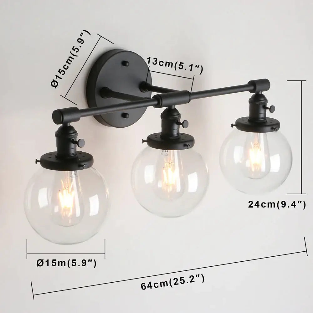 Modern black wrought iron wall sconce with three clear glass globe shades for wall sconce bathroom vanity use