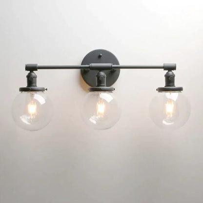 Modern black wrought iron wall sconce with three clear glass globe shades for bathroom vanity wall sconce bathroom use