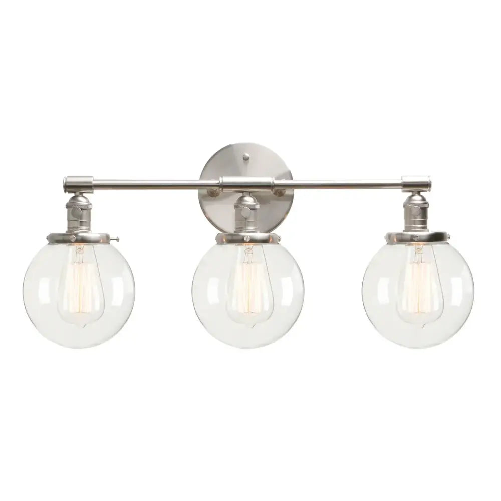 Modern black three-light wall sconce bathroom vanity fixture with clear glass globe shades and exposed filament bulbs