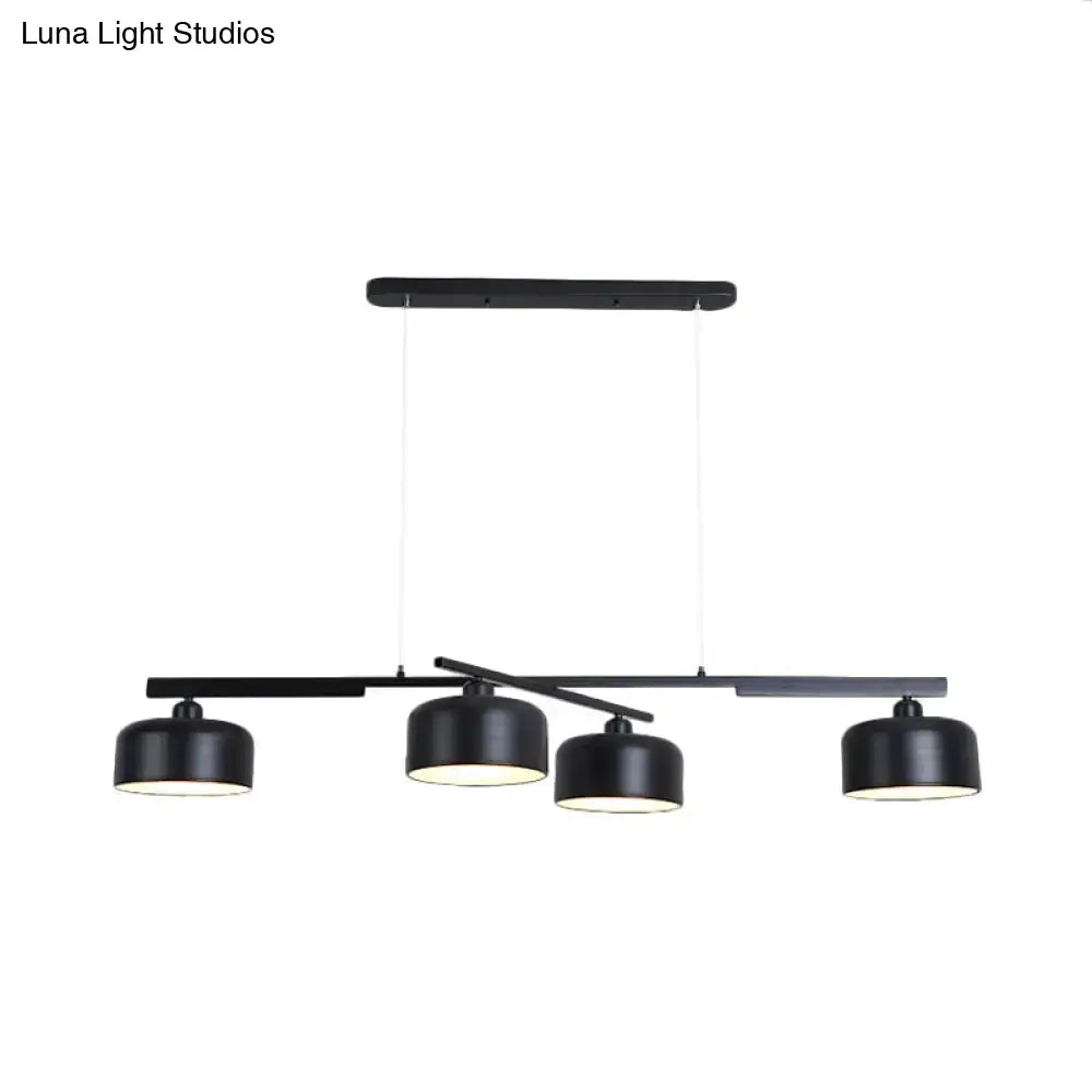 Decorbites™ rotatable chandelier with modern drum shade features four black matte metallic lights hanging from a bar