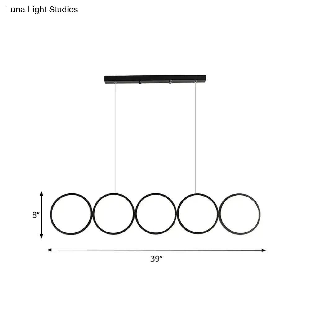 Black minimalist metal pendant light with five circular rings for decor bites hanging island light over table