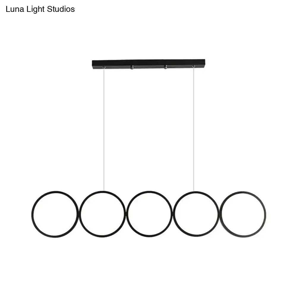 Decorbites™ led ceiling 5-ring black hanging island pendant light metal fixture with warm white light over table