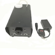Modern black 500w rgb led smoke machine with perforated sides, white cap, and black remote control for party rooms