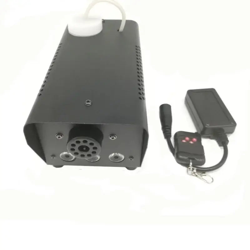 Modern black 500w rgb led smoke machine with perforated sides, white cap, and black remote control for party rooms