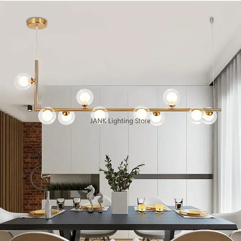 Modern black pendant light with gold-toned double glass shade globe bulbs for dining room decor
