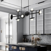 DecorBites modern black metal ceiling light fixture with circular discs and glowing white glass bulbs for kitchen use