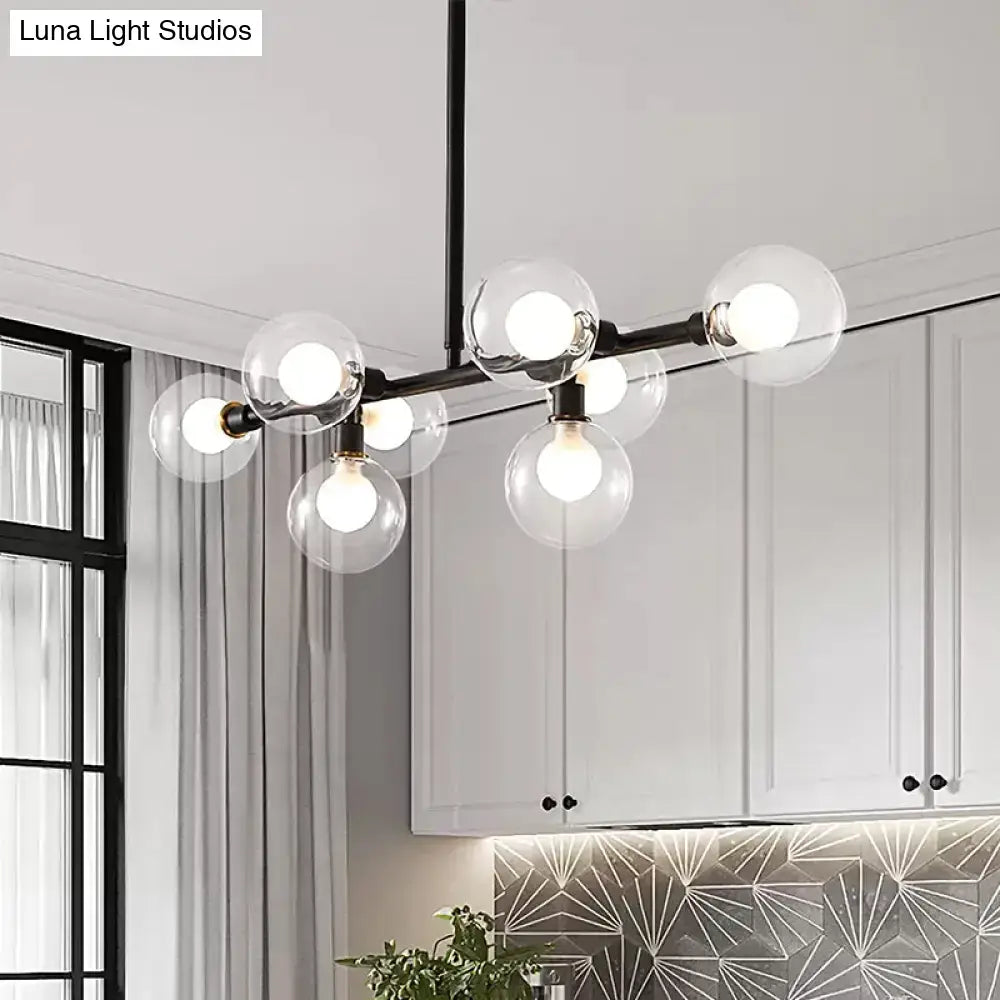 Modern black 8-head kitchen chandelier featuring a light kit with clear glass shade and clear glass globe bulbs