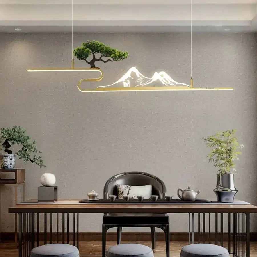 Gold-toned pendant lights with elegant acrylic mountain peak and bonsai tree design for modern living room decorbites decor