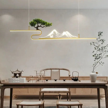 Gold-toned minimalist pendant lights with acrylic mountain peak design illuminate bonsai decorbites living room decor