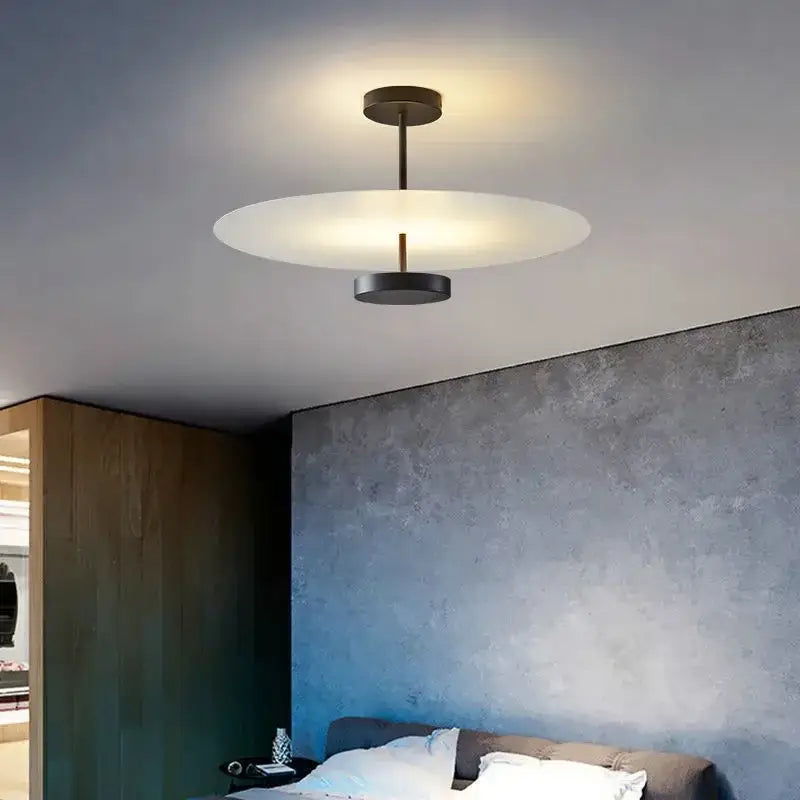 Modern black acrylic round chandelier featuring a minimalist frosted glass disc and matte black metal frame ceiling light