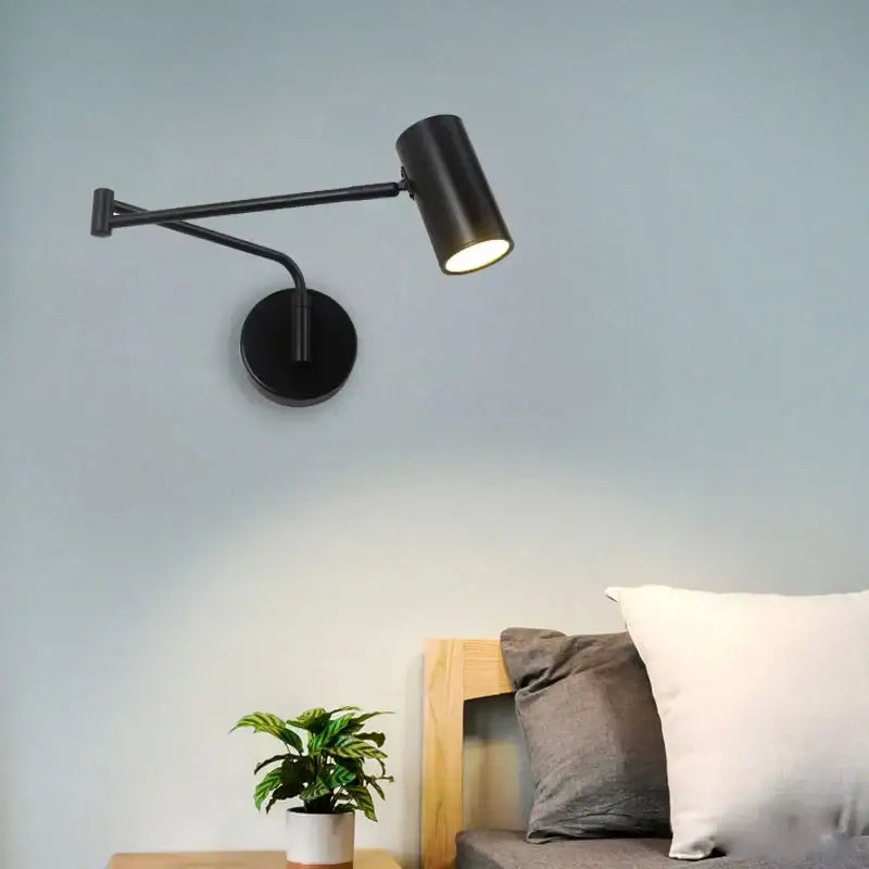 Modern black adjustable acrylic iron led wall lamp with cylindrical head and articulated arm for bedroom reading light